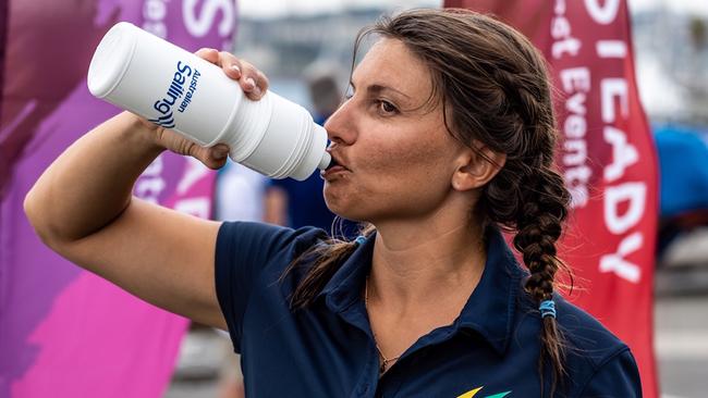 Lisa Darmanin rehydrating after a hot day on the water competing for Australia in the Nacra 17 class. Pic: Beau Outteridge