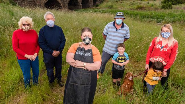 Little River residents Lynette Richmond, Terry Hedt (CFA captain), Lisa Clarke (general store), Paul Burchell (plant operator), Jacqueline Toland (petition starter) with kids Connor and Winnie. Picture: Jason Edwards