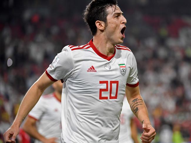 Iran's forward Sardar Azmoun celebrates after scoring a goal during the 2019 AFC Asian Cup Group D football match between Yemen and Iran at the Mohammed Bin Zayed stadium in Abu Dhabi on January 07, 2019. (Photo by Khaled DESOUKI / AFP)