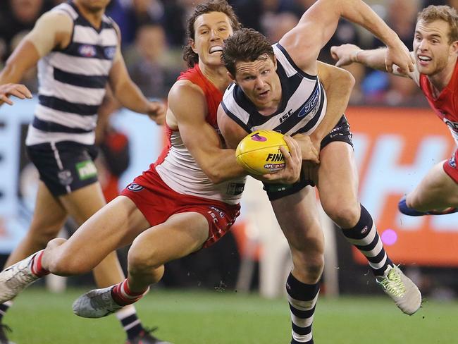 Kurt Tippett runs down Patrick Dangerfield. Picture: Michael Klein