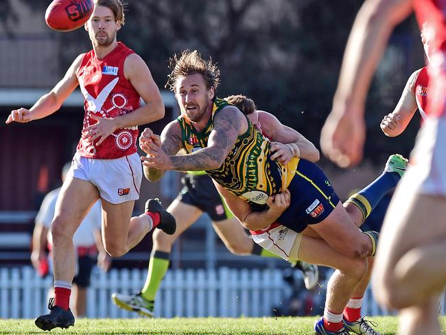 14/07/18 - SANFL: North Adelaide v Eagles at Prospect Oval.  Eagle Scott Lewis gets a handpass away.Picture: Tom Huntley