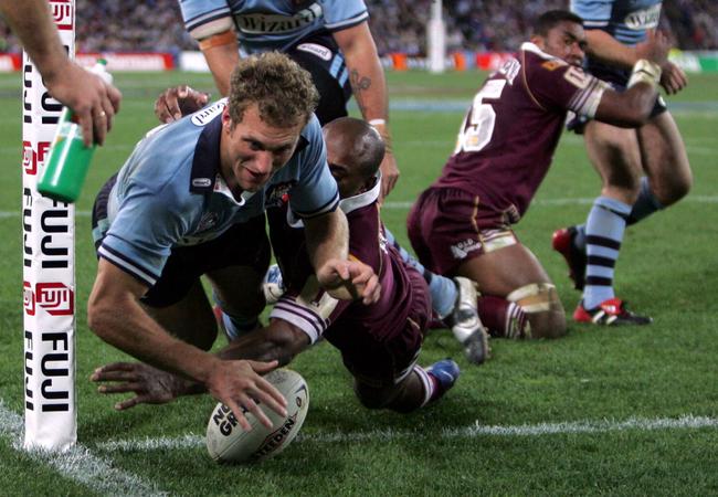 Mark Gasnier scores one of two tries during his Origin debut.