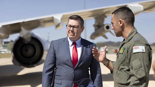 Defence Industry Minister Pat Conroy with 11 Squadron commanding officer, Wing Commander Adam Saber, at RAAF Fairbairn in Canberra. Picture: Defence