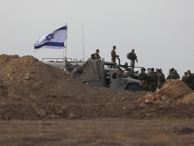 Israeli troops gathered near the border with Gaza. Picture: AFP