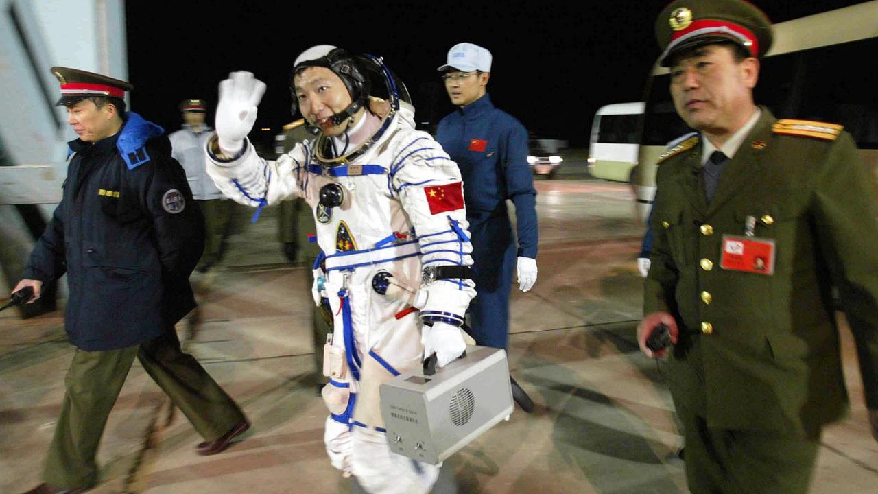 OCTOBER 15, 2003 : First Chinese astronaut Yang Liwei walks toward to China's first manned spacecraft Shenzhou 5 at Jiuquan Satellite Launch Centre in northwest China's Gansu Province 15/10/03.  Space