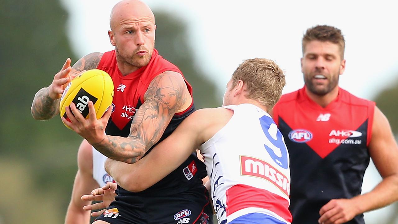 BALLARAT, AUSTRALIA - MARCH 14: Nathan Jones of the Demons is tackled by Jake Stringer of the Bulldogs during the NAB Challenge AFL match between the Western Bulldogs and the Melbourne Demons at Eureka Stadium on March 14, 2015 in Ballarat, Australia. (Photo by Quinn Rooney/Getty Images)