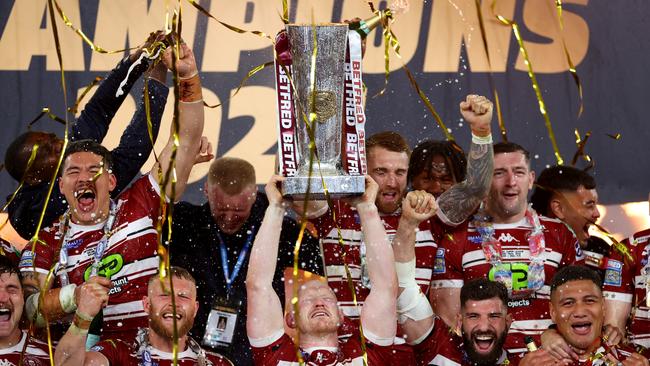 MANCHESTER, ENGLAND - OCTOBER 12: Liam Farrell of Wigan Warriors lifts the Super League Trophy after his team's victory in the Betfred Super League Grand Final between Wigan Warriors and Hull Kingston Roversat Old Trafford on October 12, 2024 in Manchester, England. (Photo by Michael Steele/Getty Images)