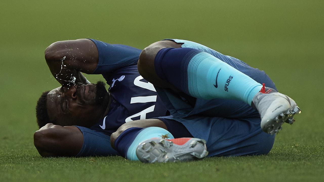 Serge Aurier of Tottenham Hotspur lies on the pitch against Girona.