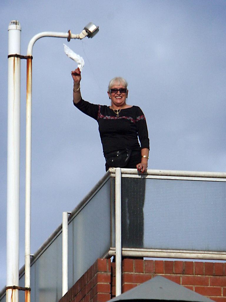 Stormy Summers waves from the roof her Waymouth Street brothel while preventing police from entering and enforcing an eviction order in 2006.