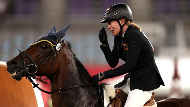 CHOFU, JAPAN - AUGUST 06: Annika Schleu of Team Germany looks dejected following her run in the Riding Show Jumping of the Women's Modern Pentathlon on day fourteen of the Tokyo 2020 Olympic Games at Tokyo Stadium on August 06, 2021 in Chofu, Japan. (Photo by Dan Mullan/Getty Images)