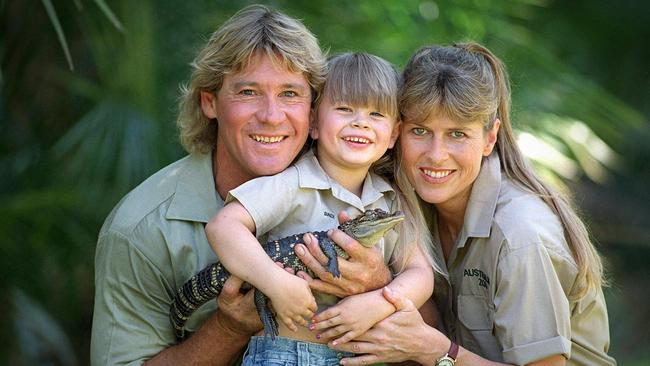 Steve Irwin with wife Terri, daughter Bindi and a baby crocodile at Australia Zoo in 2002.