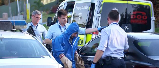 Ryan Bayldon-Lumsden being taken away by police outside his Chiffley Place home where he allegedly murdered his stepfather Robert Lumsden. Picture: 7 News Gold Coast