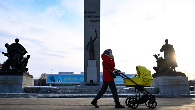 A woman pushes a pram in Bryansk, Russia. Picture: AFP