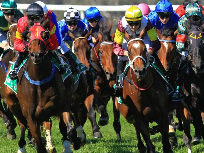 Loving home ridden by Tye Angland  (yellow cap, maroon with yellow armbands) wins race 1 during Scone  Races located in the Upper Hunter Region of NSW. The Bend . Pic Jenny Evans