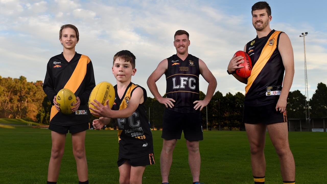 5/5/2020 - Support Our Clubs campaign - Sports clubs around the state are doing it tough but the Lobethal Football Club is one of the few hit by both the bushfires and coronavirus. Pictured are Torsten Skinner (under 14 player), Jensen Blundell (under 8 player), Matthew Fuller (coach), Cooper Skinner (senior player) at the club. Photo - Naomi Jellicoe