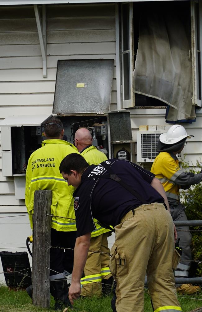 Firefighters clean up after extinguishing a unit on Albert St in Kingaroy on Tuesday.