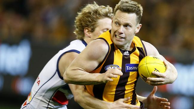 AFL Second Semi Final. Hawthorn vs Adelaide at the MCG. Sam Mitchell tries to break through the Rory Sloane tackle . Pic: Michael Klein. Friday September 18, 2015.