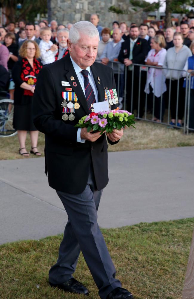 Redcliffe RSL sub-branch president Neville Cullen lays a wreath on Anzac Day. Picture Chris Higgins