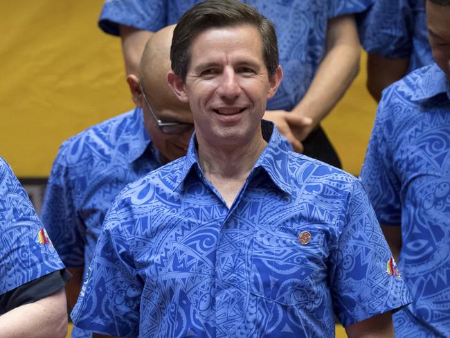 Australia's Foreign Minister Marise Payne, left, and Minister for Trade Simon Birmingham arrive for a group photo during the APEC Ministers Meeting at the International Convention Center in Port Moresby, Papua New Guinea, Thursday, Nov. 15, 2018. (AP Photo/Mark Schiefelbein)