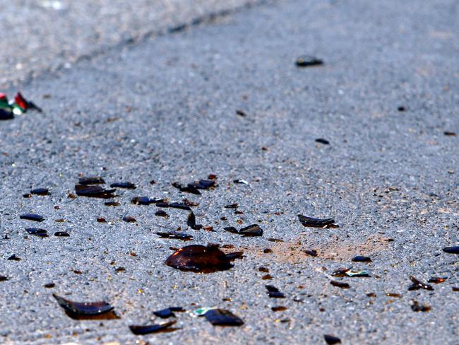 Motorists reported seeing bottle being thrown from the Holden Cruz but the men were never charged with this offence. (File image of broken glass on a road)