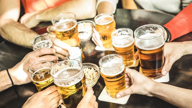 ESCAPE: UK Drink, Mikaella Clements -  Friends hands drinking beer at brewery pub restaurant - Friendship concept with young people enjoying time together and having genuine fun at cool vintage brew bar - Focus on middle right small glass . Picture: iStock