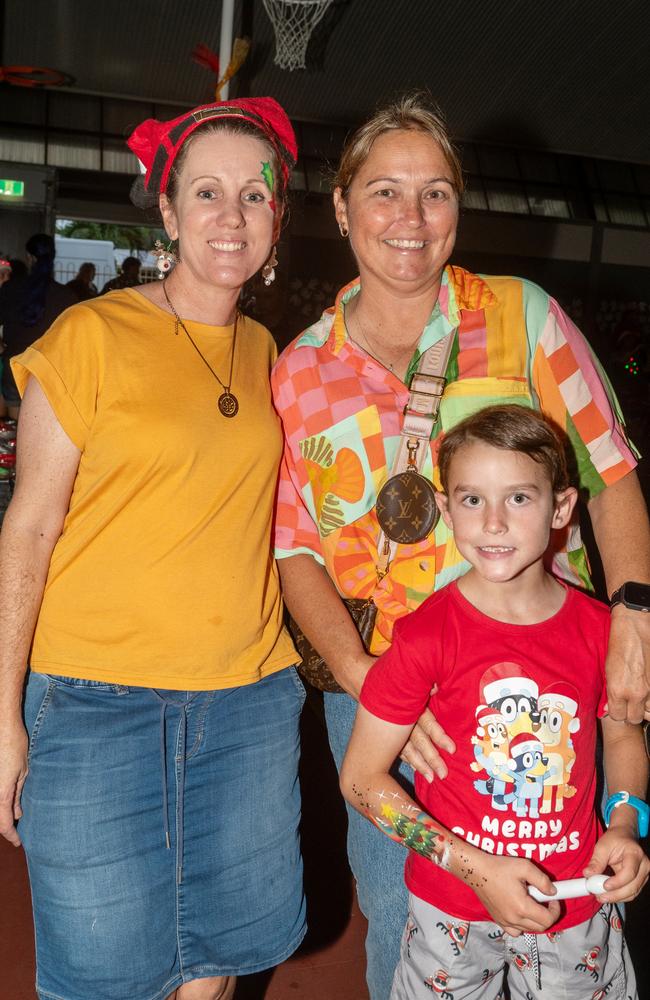 Shelley Brady, Tanya Shepherd and Matthew Parkinson at Christmas Carols Hosted by Sarina Surf Lifesaving Club Saturday 21 December 2024 Picture:Michaela Harlow