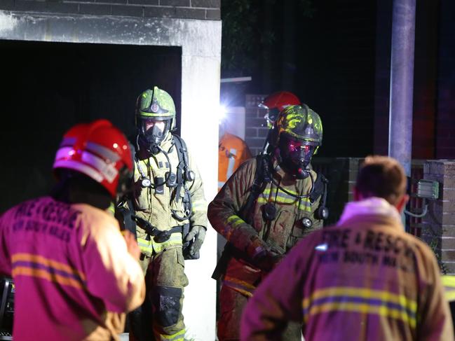 Firefighters wore breathing apparatus to tackle the fire. Picture: Bill Hearne