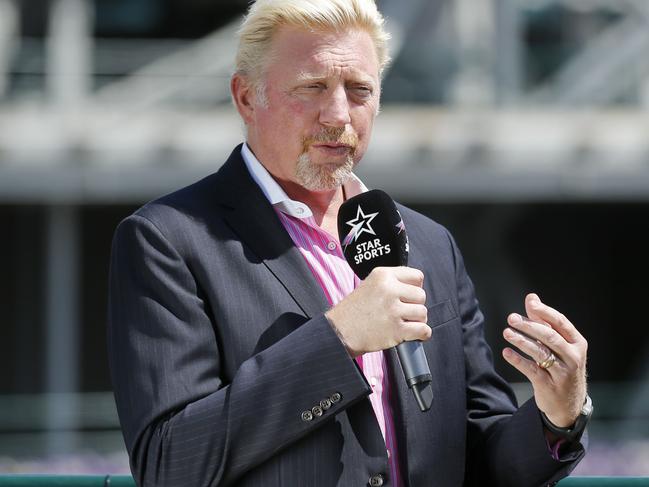 Germany's former tennis champion Boris Becker speaks on the tv channel Star Sports, at the Wimbledon Championships at the All England Lawn Tennis Club, in London, Britain,  Monday, July 10, 2017. (Peter Klaunzer/Keystone via AP)