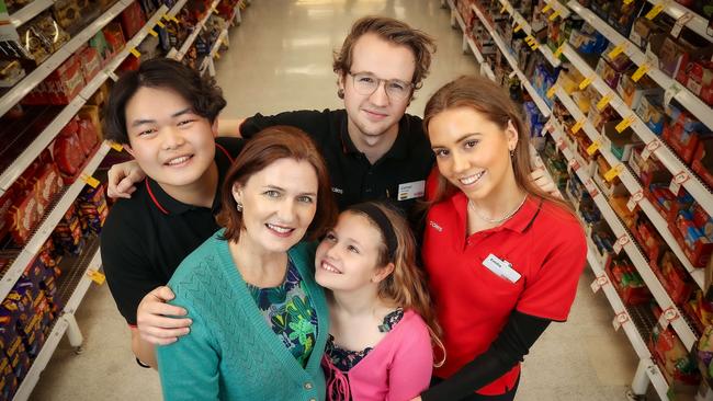 Mary Brockhoff and her daughter Beth reunite with Coles workers Roy Zeng (left), Connor Ferris and Emilia Cox who saved Ms Brockhoff’s life. Picture: NCA NewsWire / Ian Currie