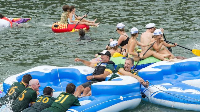 Richard Tombs (middle) during the annual Manly Inflatable Boat Race at Shelly Beach at Manly on Sunday, 23 February, 2020. (AAP IMAGE / Troy Snook)