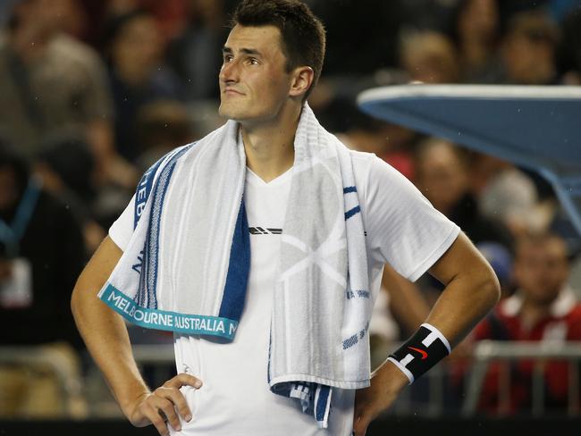 MELBOURNE, AUSTRALIA - JANUARY 20: Bernard Tomic of Australia looks on as light rain begins to fall in his third round match against Daniel Evans of Great Britain on January 20, 2017 in Melbourne, Australia. (Photo by Darrian Traynor/Getty Images)