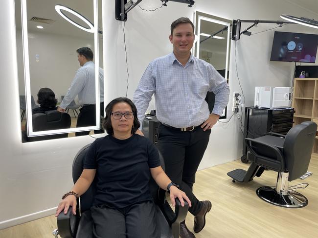 Rosita Barbershop owner Rosita Ballada shows off her new business with Colliers Townsville leasing executive Reagan Stokley. Picture: Leighton Smith.