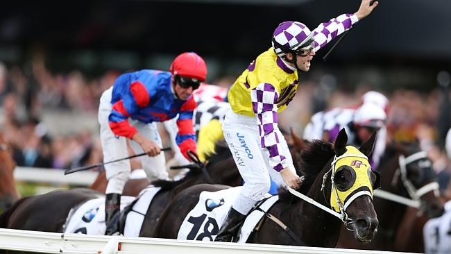 Tommy Berry - riding Sacred Falls - salutes on BMW Doncaster Day at Randwick. 