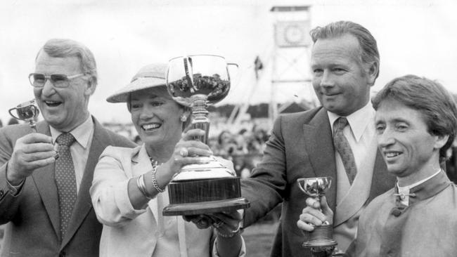 Racehorse trainer Colin Hayes (left) with Robert Sangster and his wife Susan and jockey John Letts after winning the 1980 Melbourne Cup on Beldale Ball.