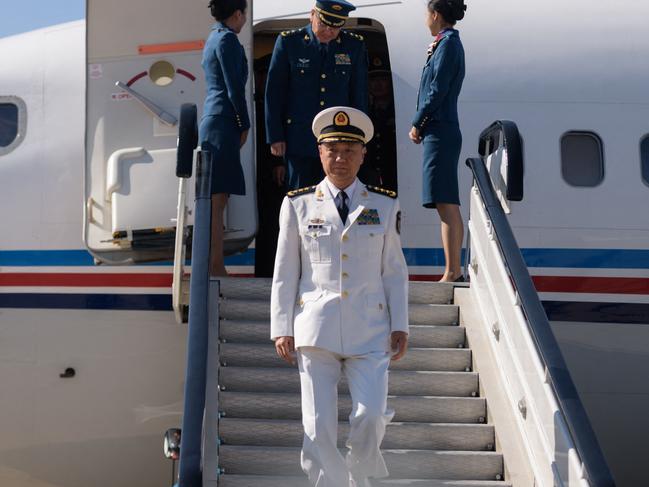 (FILES) Miao Hua (C), China's director of the political affairs department of the Central Military Commission, disembarks his aircraft after arriving at Pyongyang International Airport on October 14, 2019. China said on November 28, 2024 that top military official Miao Hua had been removed from office and was suspected of "serious violations of discipline". (Photo by KIM Won Jin / AFP)