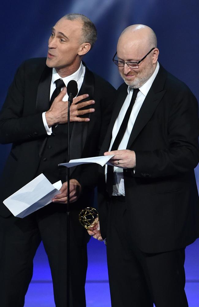 Joel Fields and Joe Weisberg accepttg the Outstanding Writing for a Drama Series. Picture: AFP