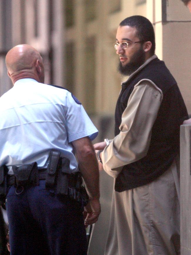 Amer Haddara is escorted from the Supreme Court of Victoria after being convicted of terrorism related offences.