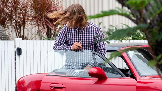 Rhys Chitty leaves court in a red Mazda MX-5 convertible after having his bail varied on Thursday. Picture: Pema Tamang Pakhrin