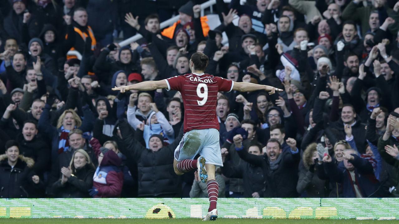 West Ham's Andy Carroll celebrates scoring his side's first goal during the English Premier League soccer match between West Ham United and Hull City at Upton Park stadium in London, Sunday, Jan. 18, 2015. (AP Photo/Matt Dunham)