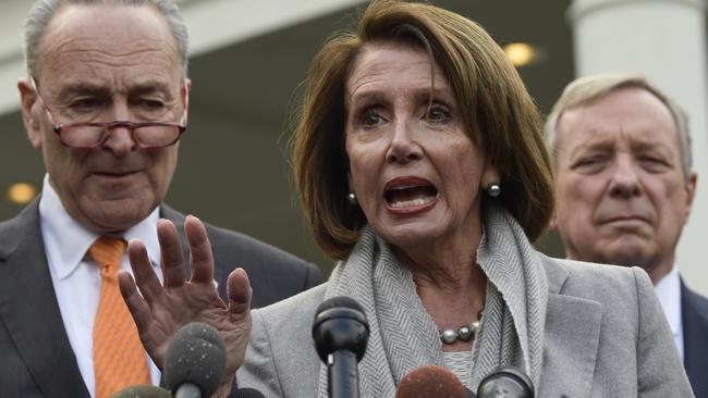 Nancy Pelosi flanked by senators Chuck Schumer, left, and Dick Durbin outside the White House yesterday. Picture: AP