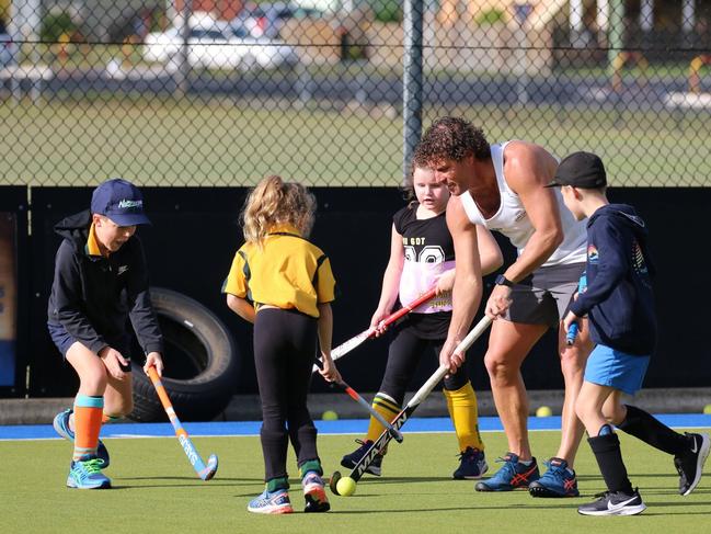 Grafton hockey legend Brent Livermore joined juniors during a school holiday hockey clinic at the Grafton fields on Thursday. Photo: Suellen Jenkins