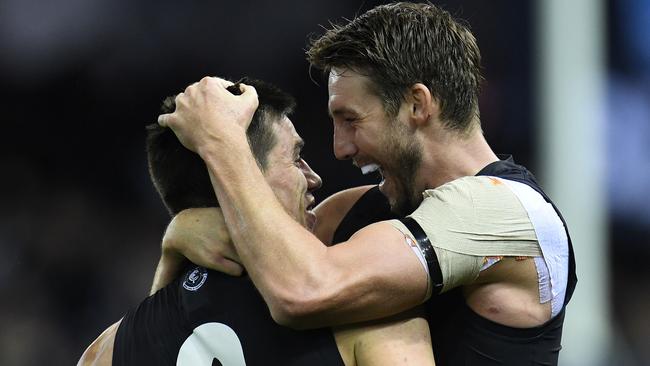 Matthew Kreuzer (left) and Dale Thomas celebrate after Sunday’s win. Picture: AAP Images