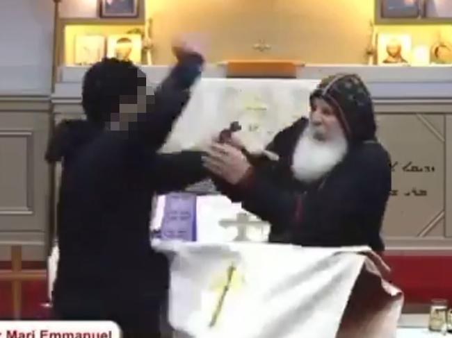 Blurred footage for the 15 year old boy who stabbed the Bishop Mar Mari Emmanuel during a service.at The Good Shepard Church in Sydney last night. Picture: Twitter