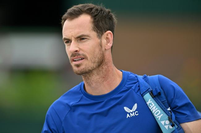 All over: Andy Murray on his way to a training session at Wimbledon