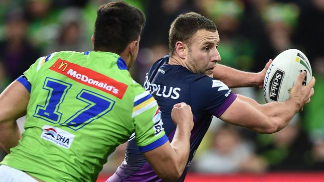 Joseph Tapine of the Raiders (left) and Blake Green of the Storm contest during the NRL preliminary final between the Melbourne Storm and the Canberra Raiders at AAMI Park in Melbourne, Saturday, Sept. 24, 2016. (AAP Image/Julian Smith) NO ARCHIVING, EDITORIAL USE ONLY