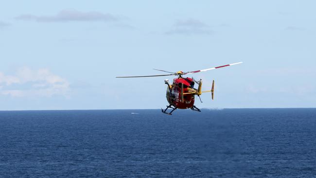 The Westpac helicopter as it leaves the scene at Little Bay. Picture: Damian Shaw