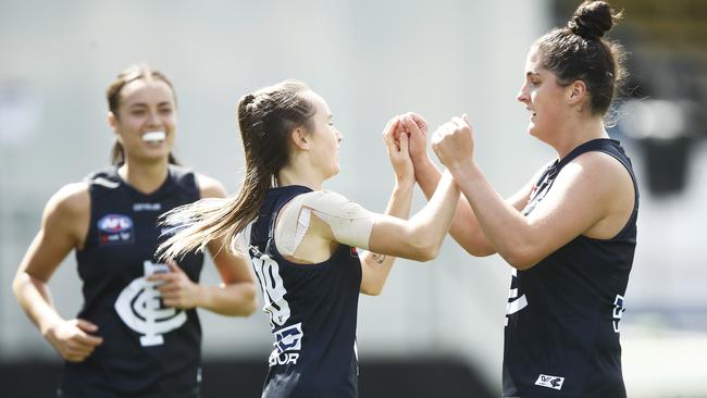 Georgia Gee celebrates one of her three goals with Lucy McEvoy. Picture: Getty