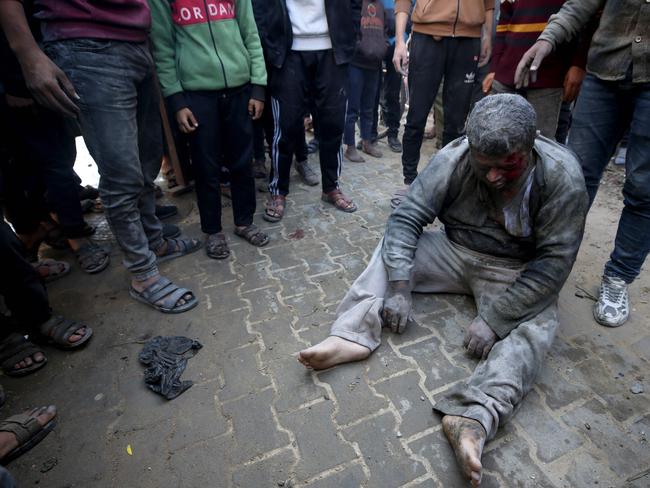 People gather around a survivor pulled from the rubble of a building following Israeli strikes on al-Maghazi refugee camp in the central Gaza Strip. Picture: AFP