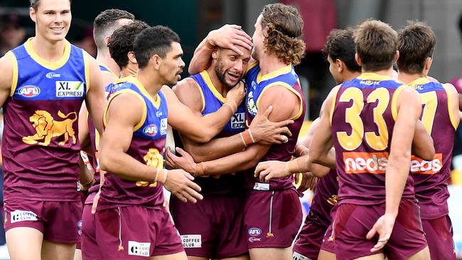 Former Crow-turned Lion, Cameron Ellis-Yolmen, is congratulated by his new teammates after kicking a goal against his old side Adelaide in Brisbane’s 37-point win at The Gabba on June 28, 2020. Picture: BRADLEY KANARIS/GETTY IMAGES