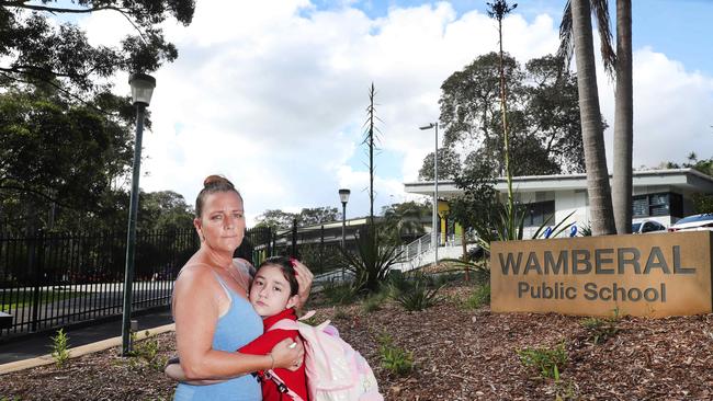 Christine Dickson with her daughter Jorgia outside Wamberal Public School. Picture: Sue Graham/AAP